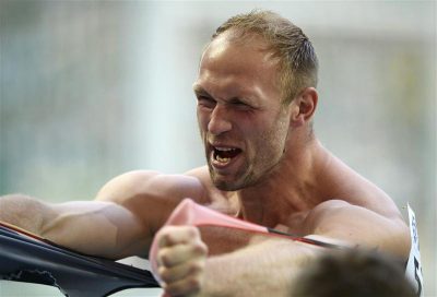 Harting of Germany rips off his shirt to celebrate winning gold at the men's discus throw final during the IAAF World Athletics Championships in Moscow